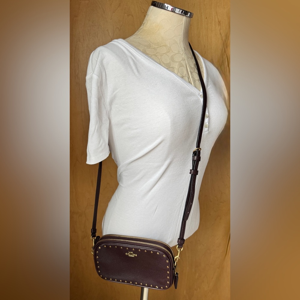 NWT Coach “Sadie” border rivets crossbody clutch color Oxblood style #31795